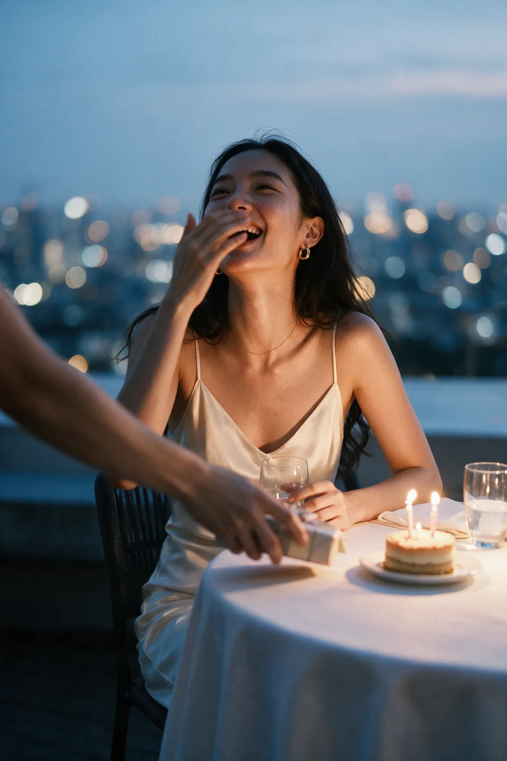 A birthday on a Bangkok rooftop, the city out of focus behind.
