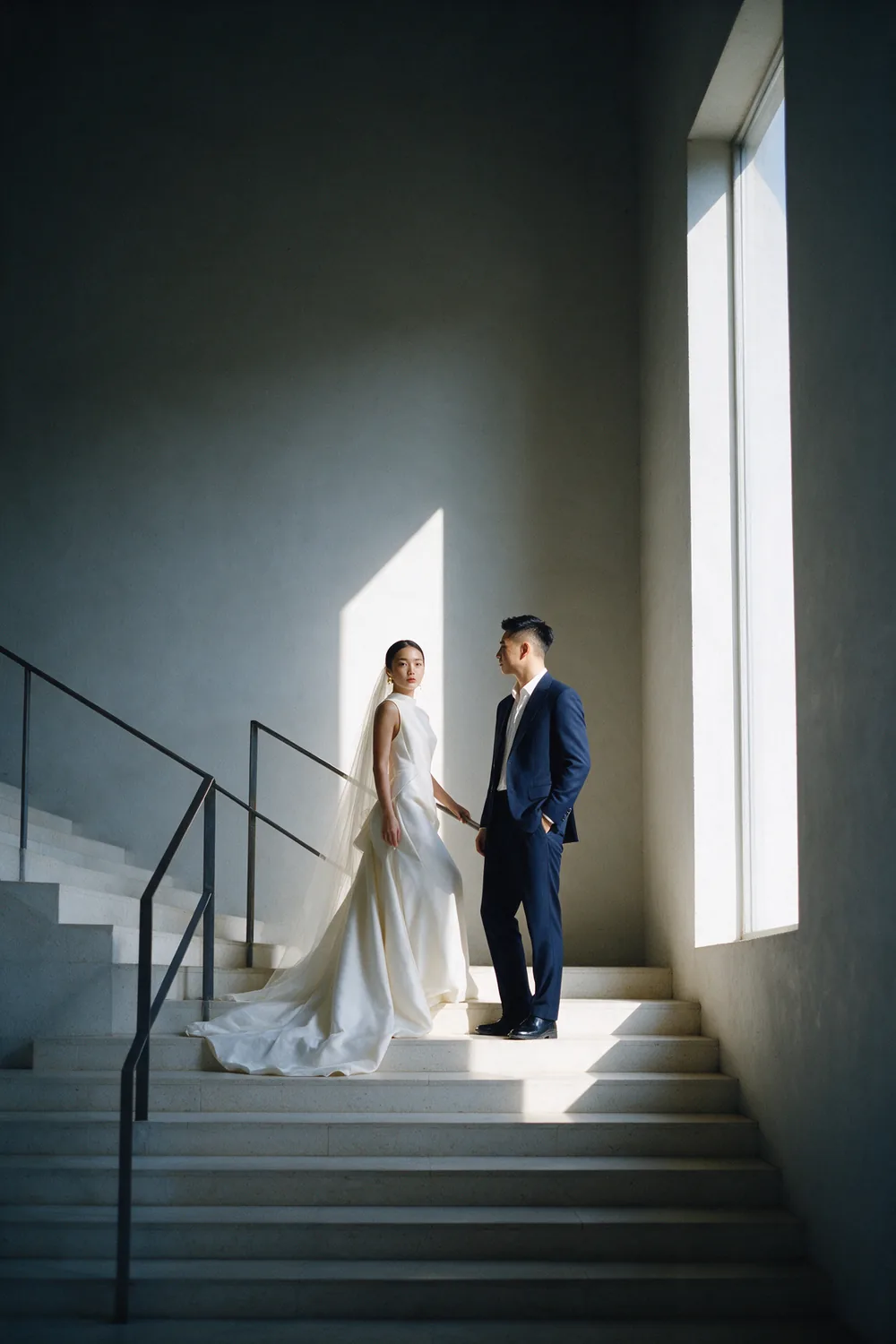 A staircase in a pale hall.